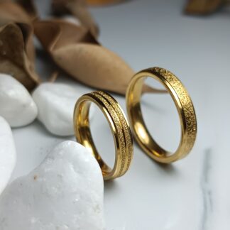 Pair of gold-colored polished steel wedding rings (CODE: 0106)