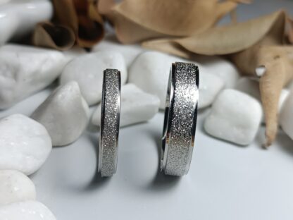 Pair of wedding rings made of steel with a sagre finish and polished edges (CODE: 0108)