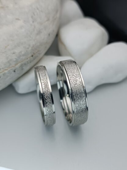 Pair of wedding rings made of steel with a sagre finish and polished edges (CODE: 0108)