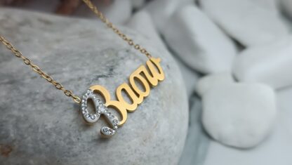 Steel necklace with the name "VASO" gold-plated with zircons in gold color (CODE: 02020)