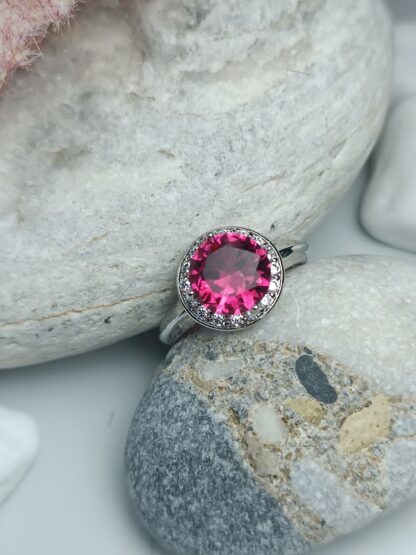 Ring with fuchsia stones Zircon steel (CODE: 22008)